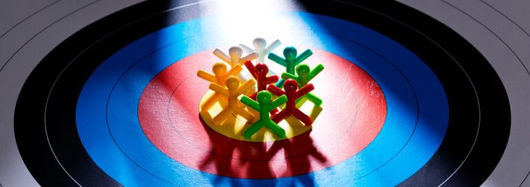Plastic people on a bullseye target