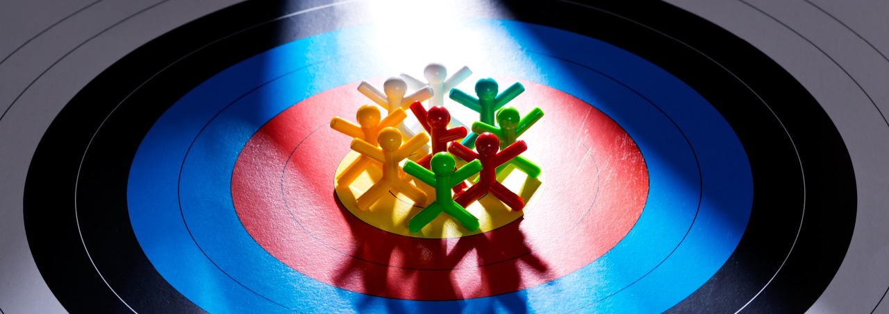 Plastic people on a bullseye target